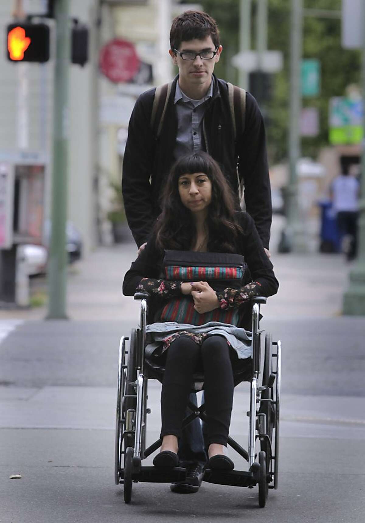 Eli Reyes arrives at the Wiley W. Manuel Courthouse with her boyfriend Ivan Navarro to attend a preliminary hearing in Oakland, Calif. on Thursday, May 16, 2013. Reyes is still recovering from injuries from a hit-and-run driver back in April.