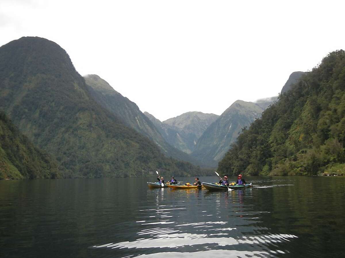 Kayakers on an overnight tour around Doubtful Sound on New Zealand's south island.