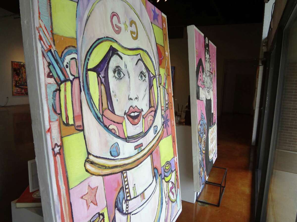 Rex Hausmann's paintings “Galaxy Gal” (left) and “Simply Fab-u-LS Daalng” face out the front windows of Gallery Nord.