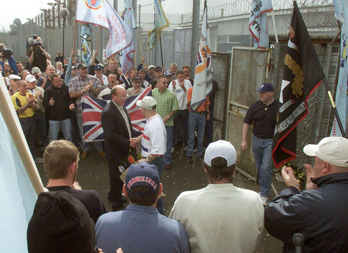 Ulster Freedom Fighters are welcomed as loyalist prisoners are released from the Maze prison near Belfast, Northern Ireland, in July 2000. The prison closed shortly afterward.