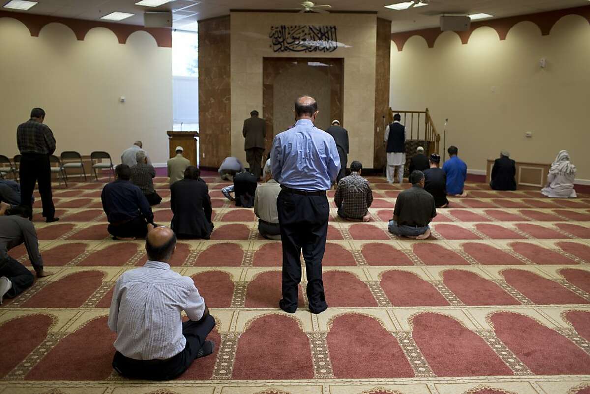 Men pray in the Ibrahim Khalilullah Islamic Center on Friday, May 17, 2013 in Fremont, Calif.