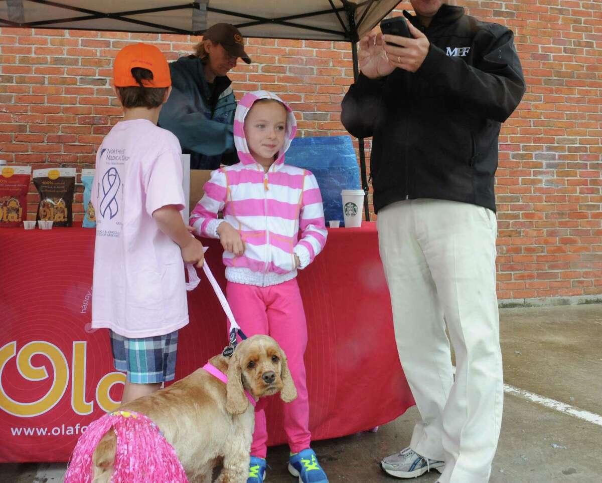 Ryan Genovese, 9, Annie, their dog Cody and father David, registering at the Breast Cancer Alliance's "Walk for Hope," at Richard's on Greenwich Avenue, in Greenwich, Sunday, May 19, 2013. The Alliance funds breast cancer research.