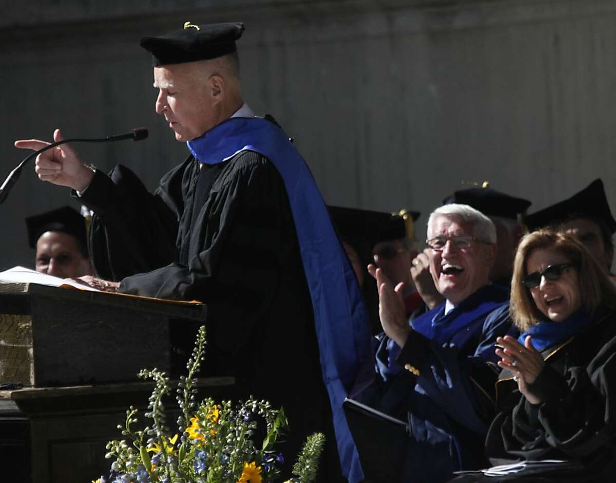 Anne Gust Brown (right) and UC Berkeley Chancellor Robert Birgeneau laugh as Gov. Jerry Brown makes a point in the commencement address for Cal political science students.