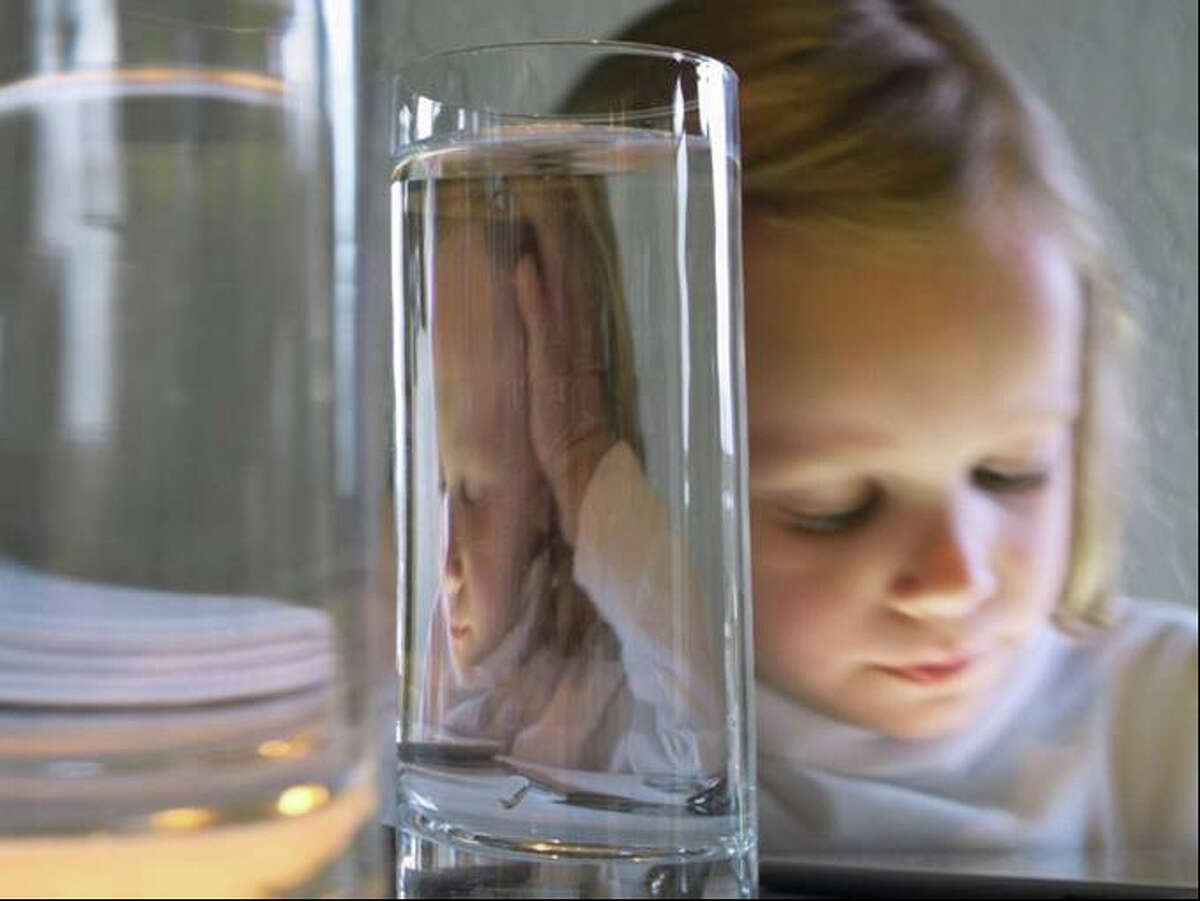 Torrance York of New Canaan was named the grand prize winner in the "professional serious amateur" category of Fairfield Museum and History Center's juried photography exhibition for her piece, "Refractions 3/19/12 #1150," an image of her 7-year-old daughter.