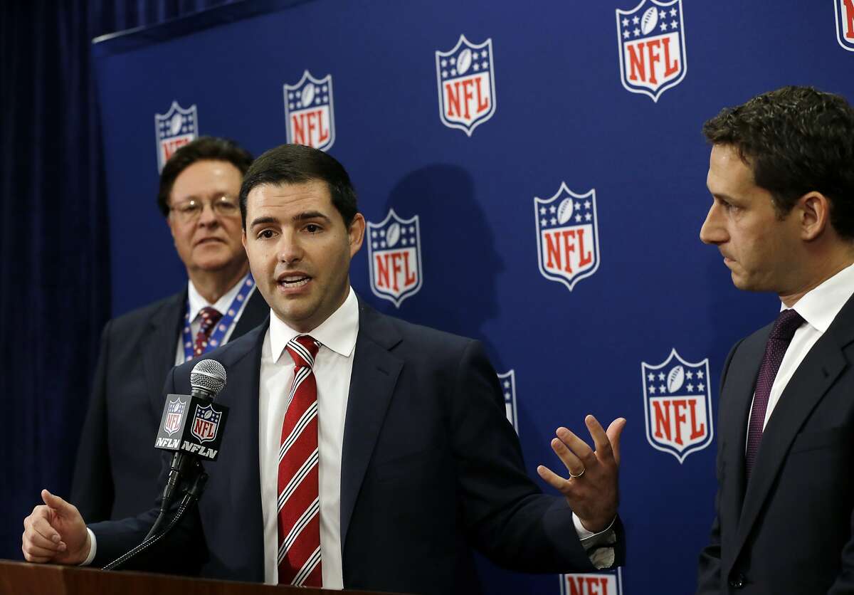 San Francisco 49ers football team CEO Jed York speaks as bid chairman Daniel Lurie, right, and team owner John York, left, listen during a news conference at the NFL spring meeting in Boston, Tuesday, May 21, 2013, discussing their successful bid to host Super Bowl 2016. (AP Photo/Elise Amendola)