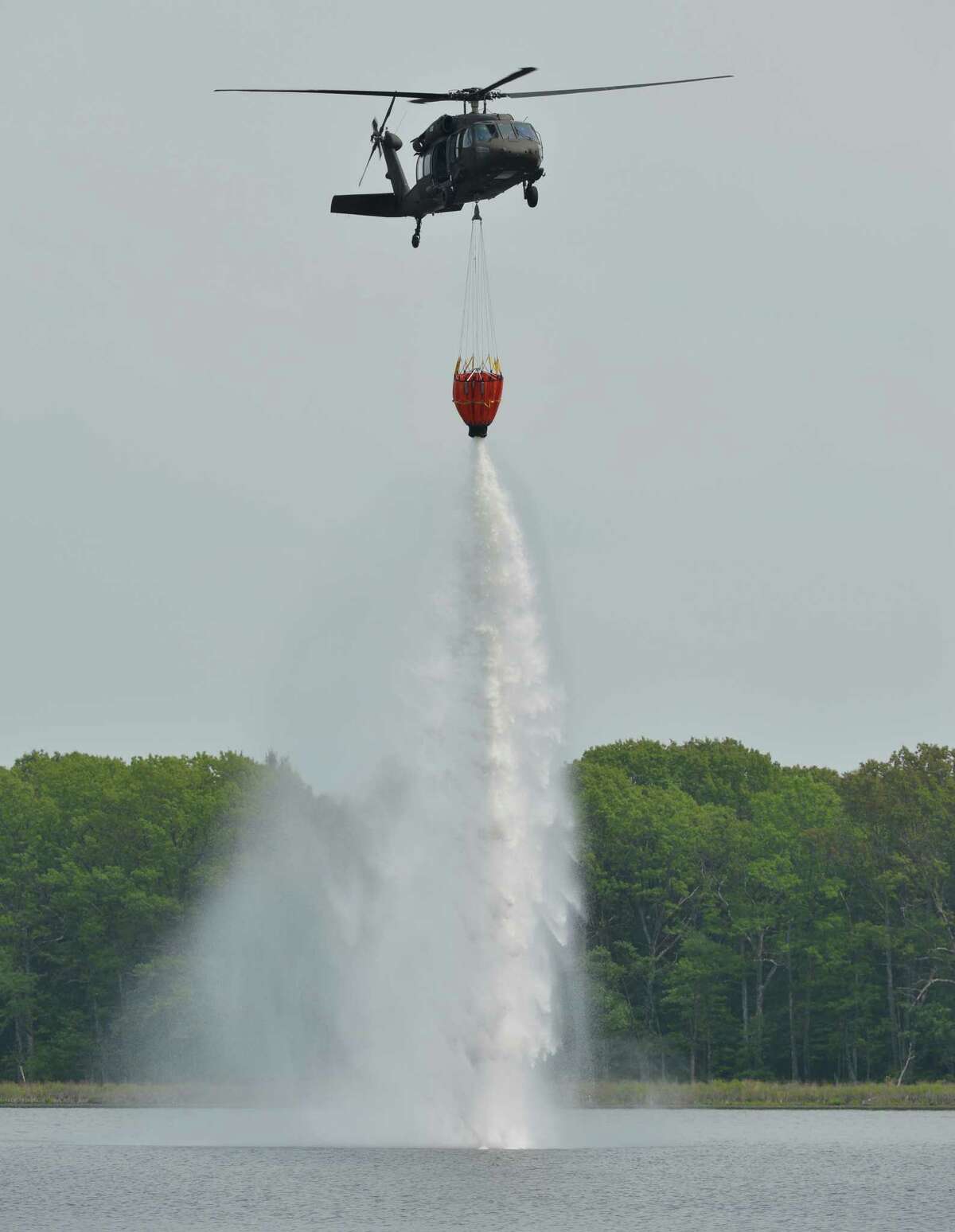 National Guard helicopters have water bucket training