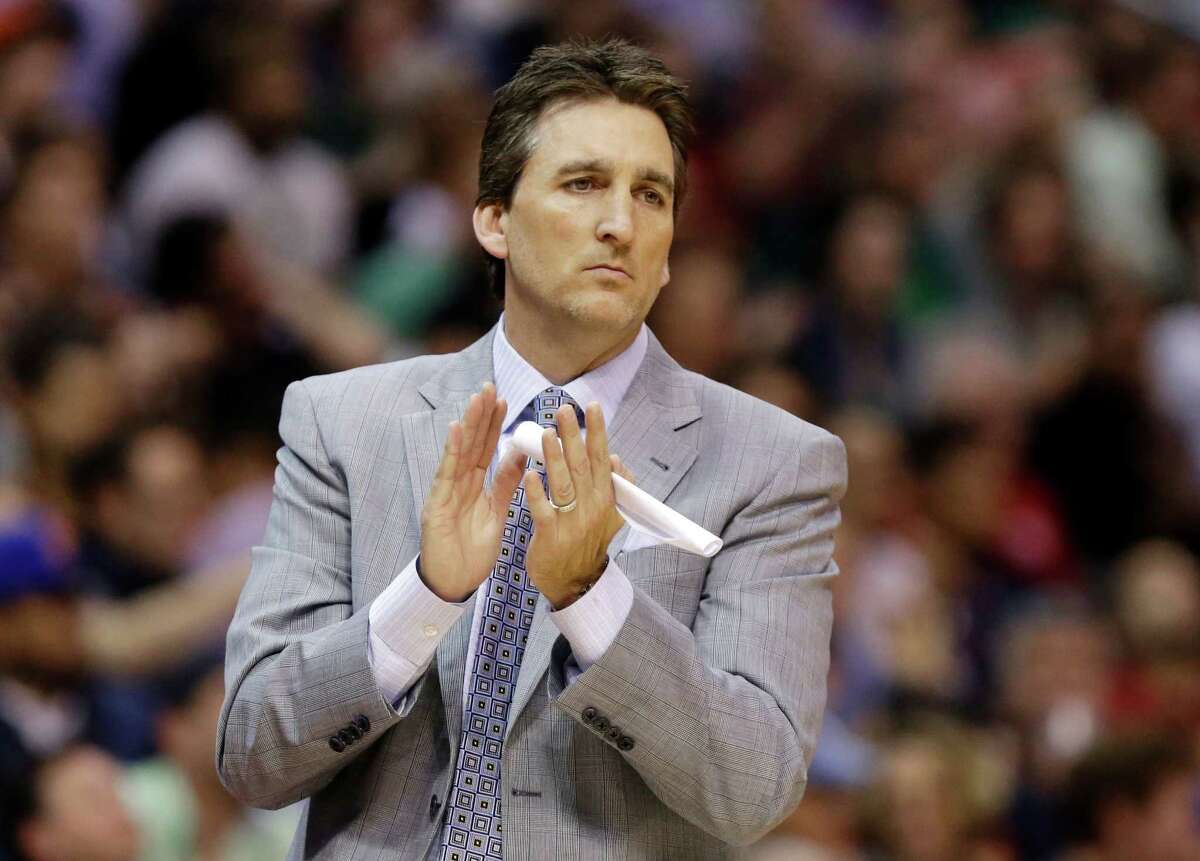 FILE - In this March 17, 2013, file photo, Los Angeles Clippers head coach Vinny Del Negro aplaudes during the second half of an NBA basketball game against the New York Knicks in Los Angeles. Del Negro is out as coach of the Clippers after a season in which the team won its first division title but lost in the first round of the playoffs. (AP Photo/Reed Saxon, File)