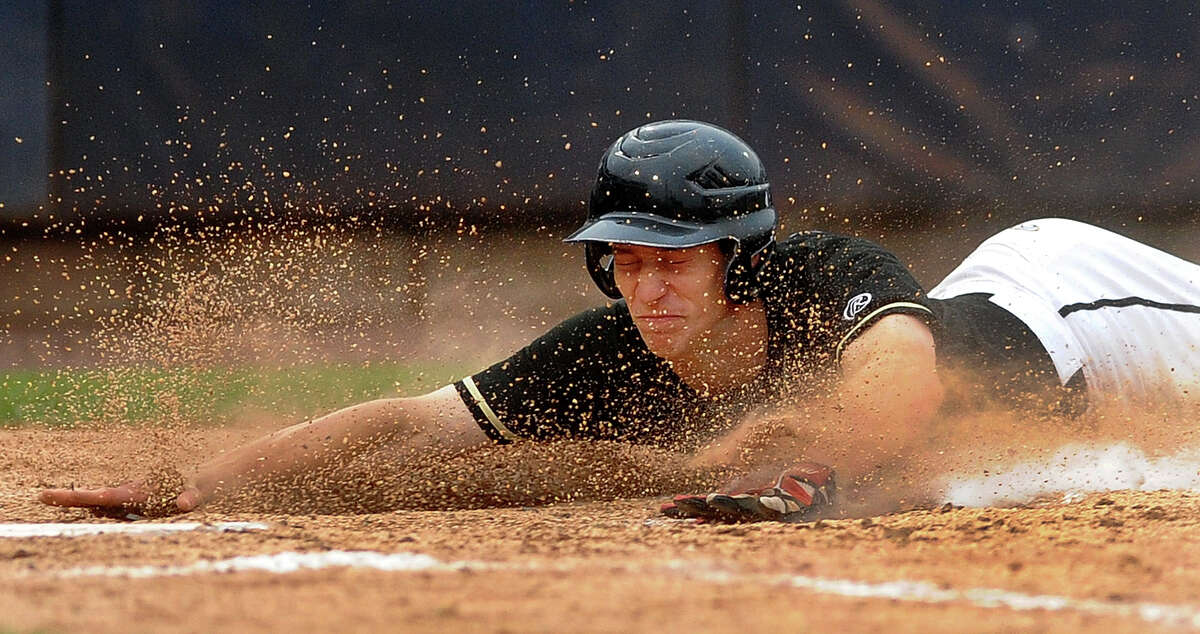Trumbull's Jake Levison dives head first into homeplate to score, during FCIAC Baseball Championship semi-final action against Greenwich at the Ballpark at Harbor Yard in Bridgeport, Conn. on Wednesday May 22, 2013.