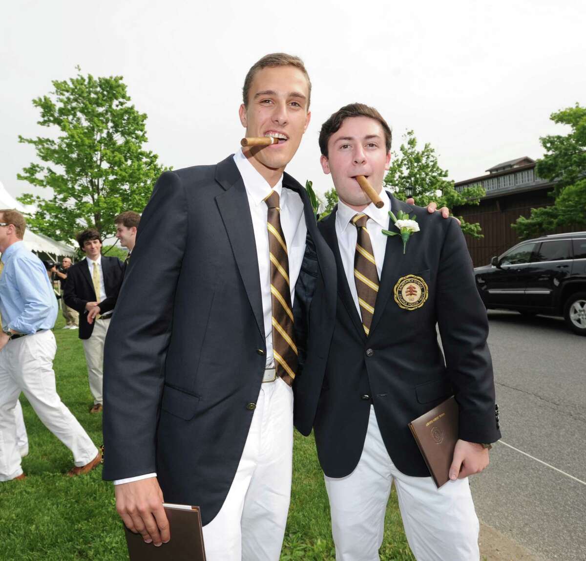 Brunswick School graduating seniors, Will Floersheimer, left, and Sam Zuckert, both 18 and both Greenwich residents, with their Brunswick School diplomas and unlighted cigars after the Brunswick School Graduation at the school in Greenwich, Wednesday, May 22, 2013.