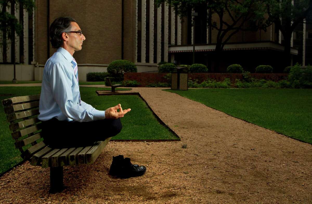 Dr. Lorenzo Cohen of M.D. Anderson meditates outside of M.D. Anderson's Cancer Prevention Building. He recently published a study about how the ancient practice of Qigong helps cancer patients cope with the disease and its side effects.