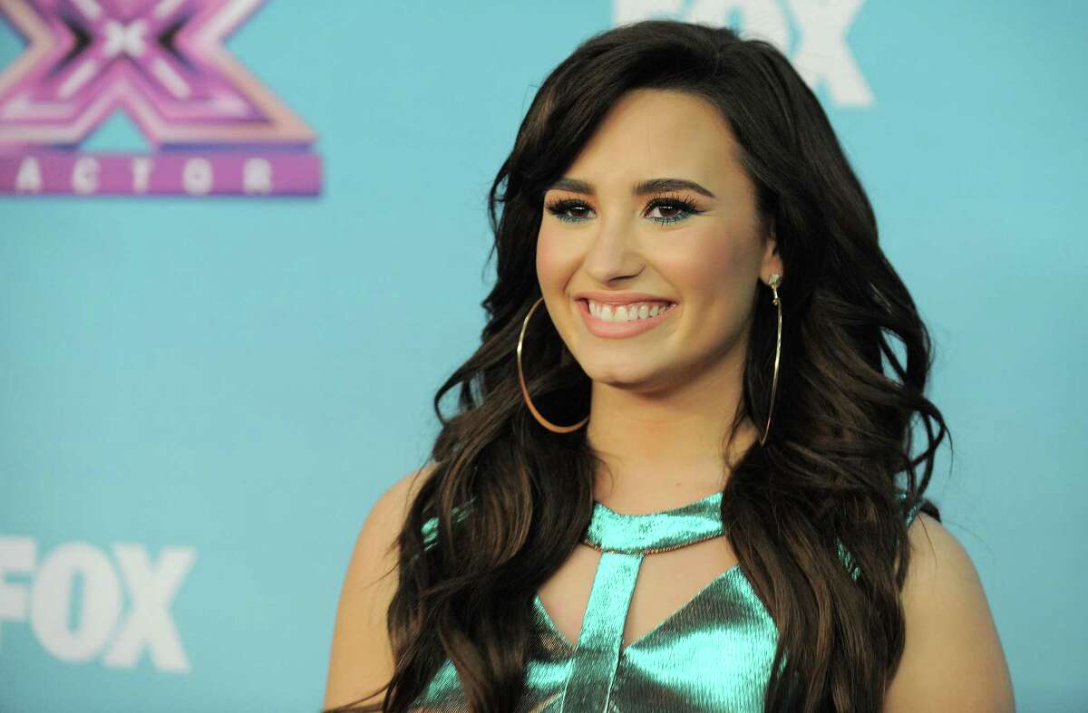 In this Dec. 20, 2012 photo, Demi Lovato attends the "The X Factor" season finale results show at CBS Television City in Los Angeles. Fox network says Lovato is returning as a judge of "The X Factor." The singer-songwriter will be back alongside series creator Simon Cowell when the singing competition begins its third season this fall. (Photo by Jordan Strauss/Invision/AP)