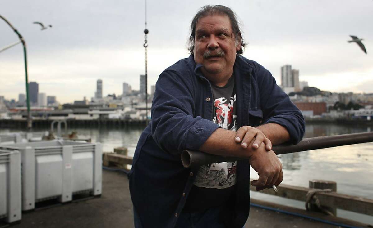Larry Collins, president of of fisherman's co-op called the San Francisco Community Fishing Assoc., waits for a crabbing boat to come in with a haul near fisherman's wharf on Jan. 22, 2013 in San Francisco, Calif. For hundreds of years, small, independent businessmen like Collins, a garrulous crab and sole fishermen, were free to harvest the seas. A new system that is slowly and steadily handing over a $400 billion ocean fishing industry to corporate interests called "catch shares," is squeezing out the small fishing operations all over the country. "I'll fight this till the day I die," said Miller who feels all the fish in the ocean should belong to the public trust.