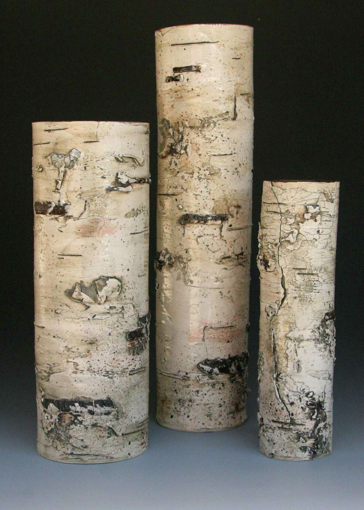 Michigan artist Elizabeth Delyria's stoneware vases look so much like actual birch logs that viewers might have to see the smooth, hollow interior to believe they're not actually wood; $TK at Asher Gallery in the Houston Center for Contemporary Craft.