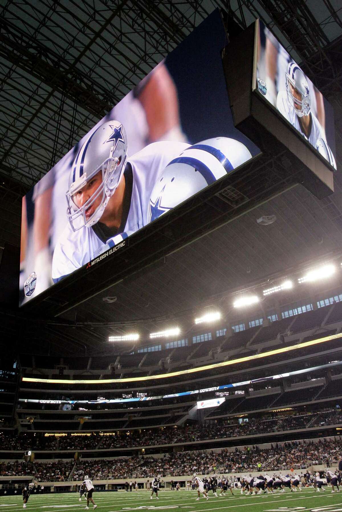 Quarterback Tony Romo projects a giant image in the video screen above Cowboys Stadium, but a reader expects little things from the Dallas Cowboys this year — and for years to come.  