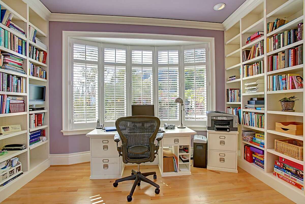 The office comes with built-in bookshelves and views of the surrounding landscape.