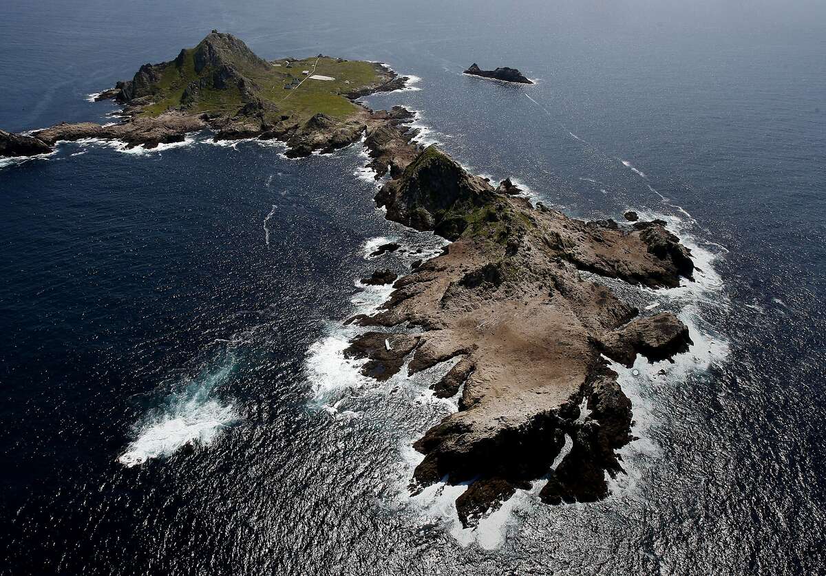 A view of the Farallon Islands. The sailing vessel can be seen on the left side of the island in the foreground. The sailing vessel Low Speed Chase lay on its side on the Farallon Islands Monday April 16, 2012. Five people lost their lives during a race Saturday.