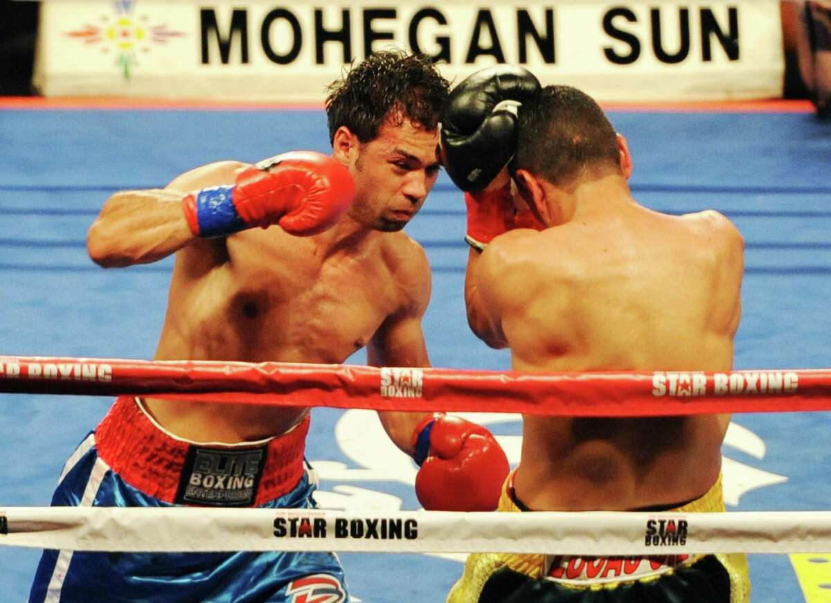 Danbury boxer Delvin Rodriguez, left, fights Freddy Hernandez for the IBF North American junior-middleweight title in the main event of ESPN's "Friday Night Fights" at the Mohegan Sun Casino in Uncasville, Conn. on Friday, May 24, 2013.