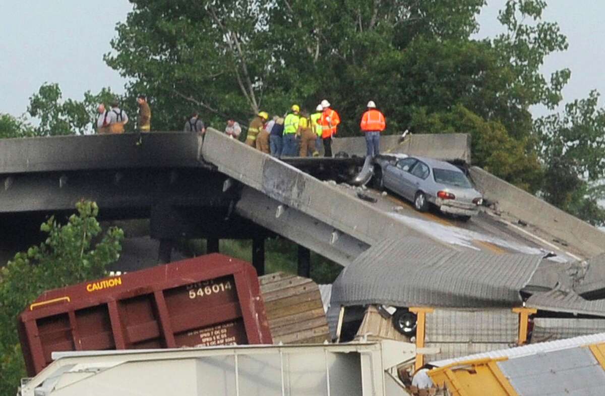 Mo. highway buckles after rail cars hit overpass