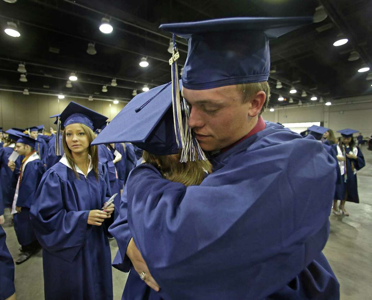 Southmoore High School senior Jake Spradling and a classmate attend their commencement ceremony five days after a tornado destroyed much of the Oklahoma City suburb of Moore.