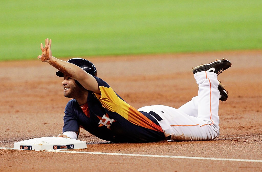 Houston Astros second baseman Jose Altuve fields a ground ball hit by  Oakland Athletics' Chris Young in the first inning during a baseball game,  Sunday, May 26, 2013, in Houston. (AP Photo/Patric