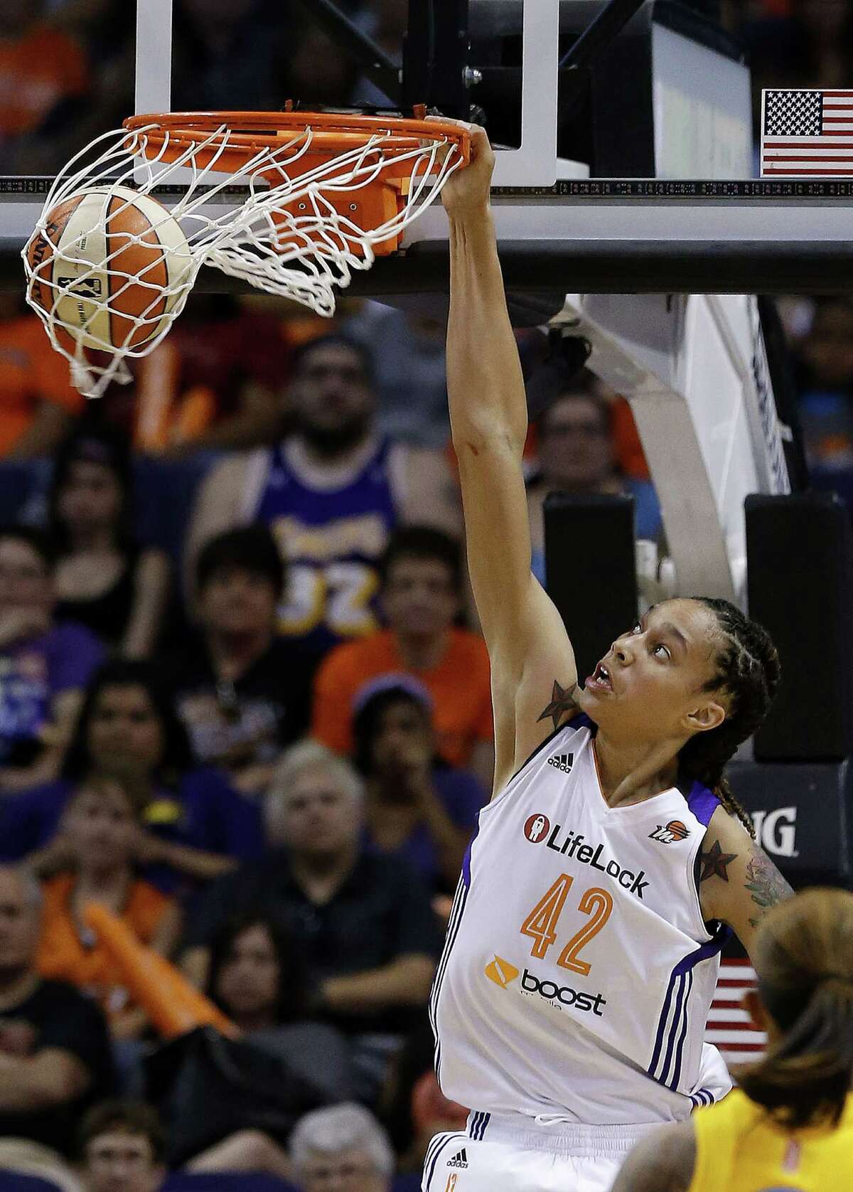 Phoenix Mercury's Brittney Griner gets her first dunk against the Chicago Sky in the second half during a WNBA basketball game on Monday, May 27, 2013, in Phoenix. The Sky defeated the Mercury 102-80. (AP Photo/Ross D. Franklin)