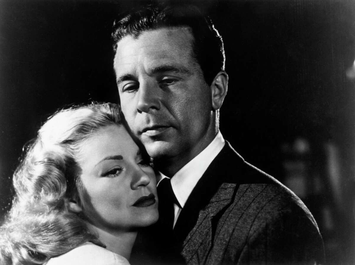American actors Claire Trevor and Dick Powell pose for a promotional portrait for director Edward Dmytryk's film, "Murder, My Sweet." The 1940s film will be featured during a "Night of Noir" at the Avon Theatre in Stamford, Conn., on Thursday, May 30. The evening begins at 7:30 p.m. and will include a question-and-answer session with host Michael Kovner of Greenwich. For more information, call 203-967-3660, Ext. 2, or visit http://avontheatre.org. (Photo by Hulton Archive/Getty Images)