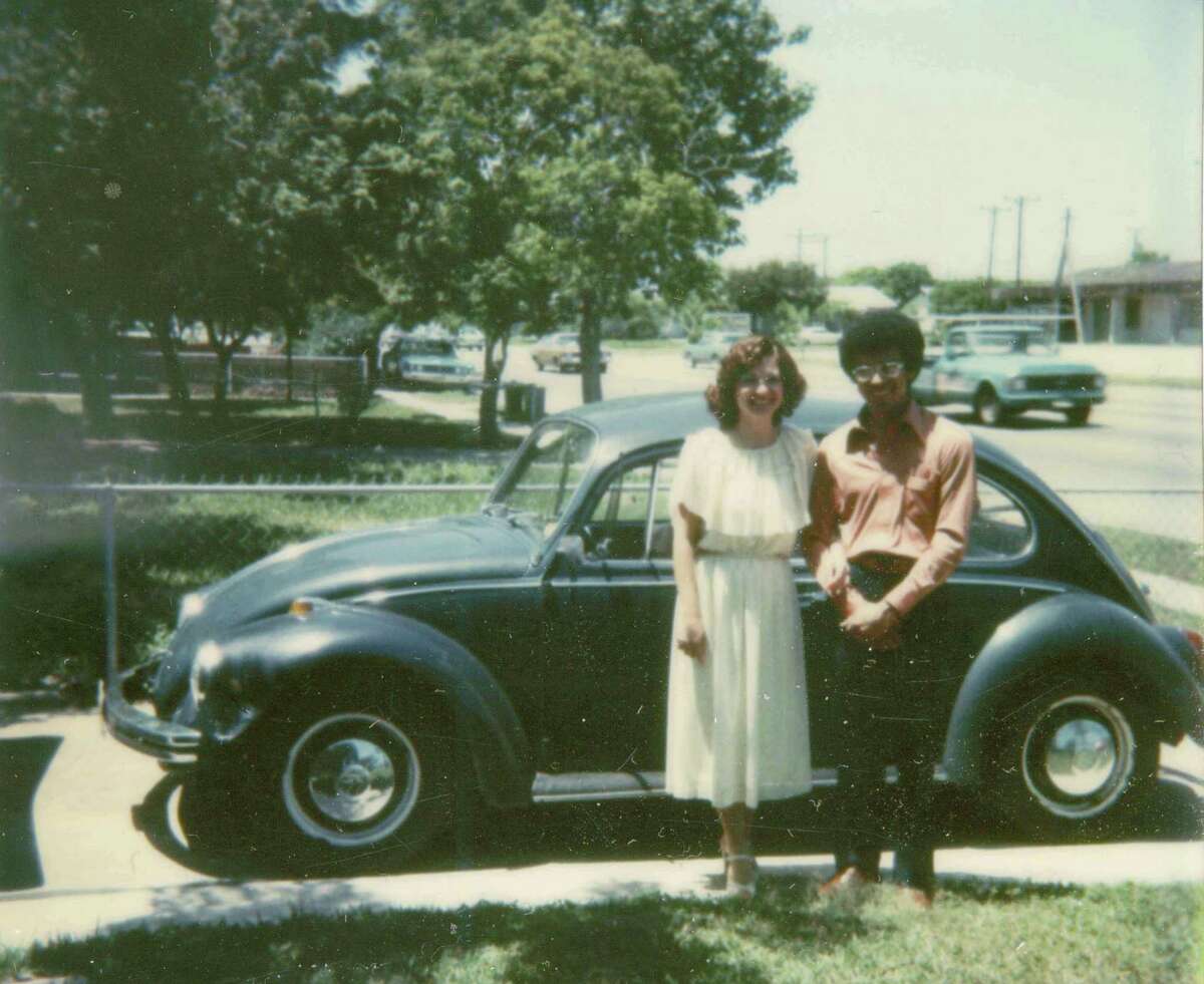 Taken on April 24, 1978, Corpus Christi, TX in front of David's mother's home. Pictured is David Cuevas and Estella Cuevas the day of their wedding, the day they had to move to St. Louis, MO because of David's promotion to Area Manager-Operators Services Facilities Administration with Southwestern Bell Telephone (now AT&T). Estella also an employee of Southwestern Bell already had a secured position in St. Louis waiting for her. The blue 1970 VW was their mode of transportation.