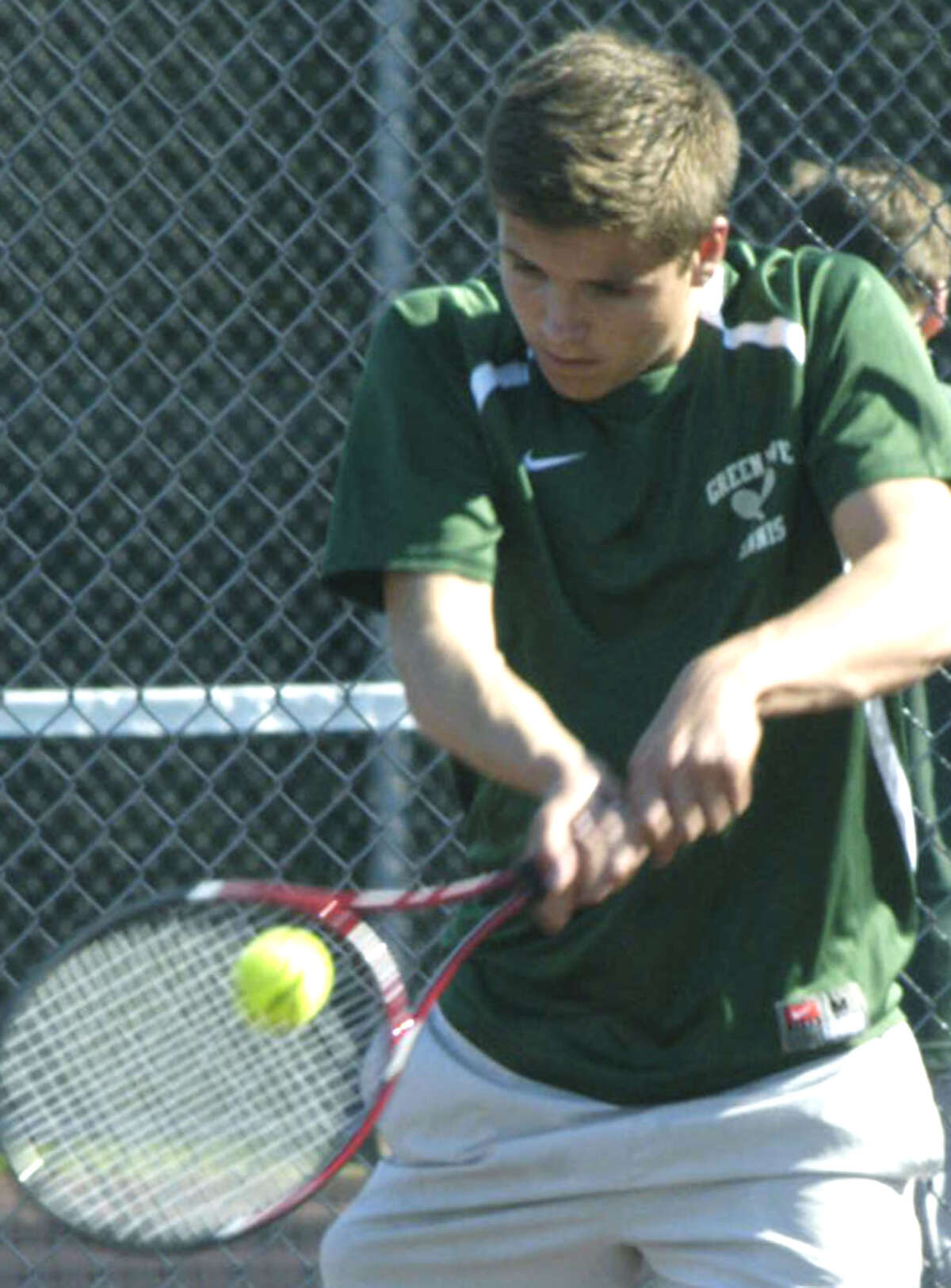 Andrew Pivetz of the Green Wave focuses on a return for New Milford High School boys' tennis, May 2013.