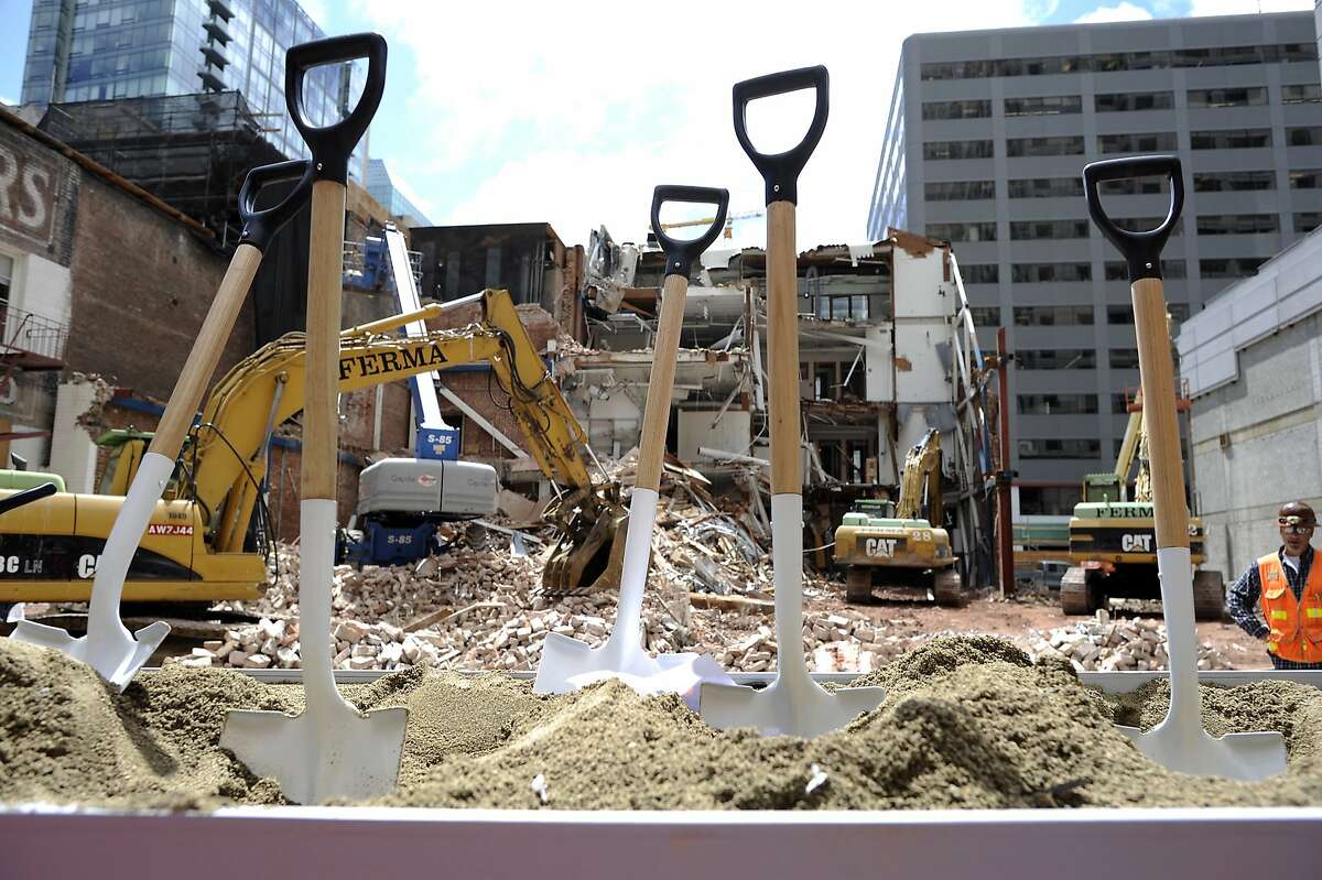 Shovels used for the ceremonial first dig sit in the ground in front of the construction area at SFMOMA's groundbreaking ceremony for the museum's new 225,000-square-foot expansion in San Francisco, CA on Wednesday May 29th, 2013.
