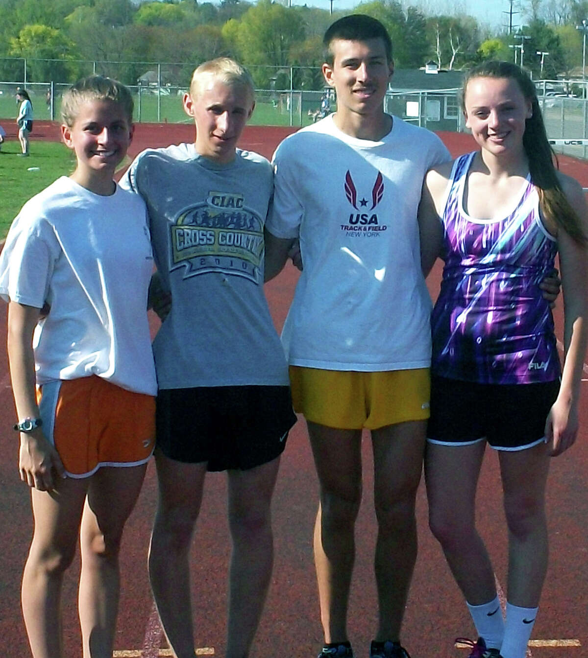 Representing the New Milford High School track & field and cross country programs in accepting grant money from the Roxbury road race series are Green Wave athletes, from left to right, Sofia Amaral, John Hansell, Ryan Clarke and Jessica Noteware. May 2013 Courtesy of Scott Benjamin