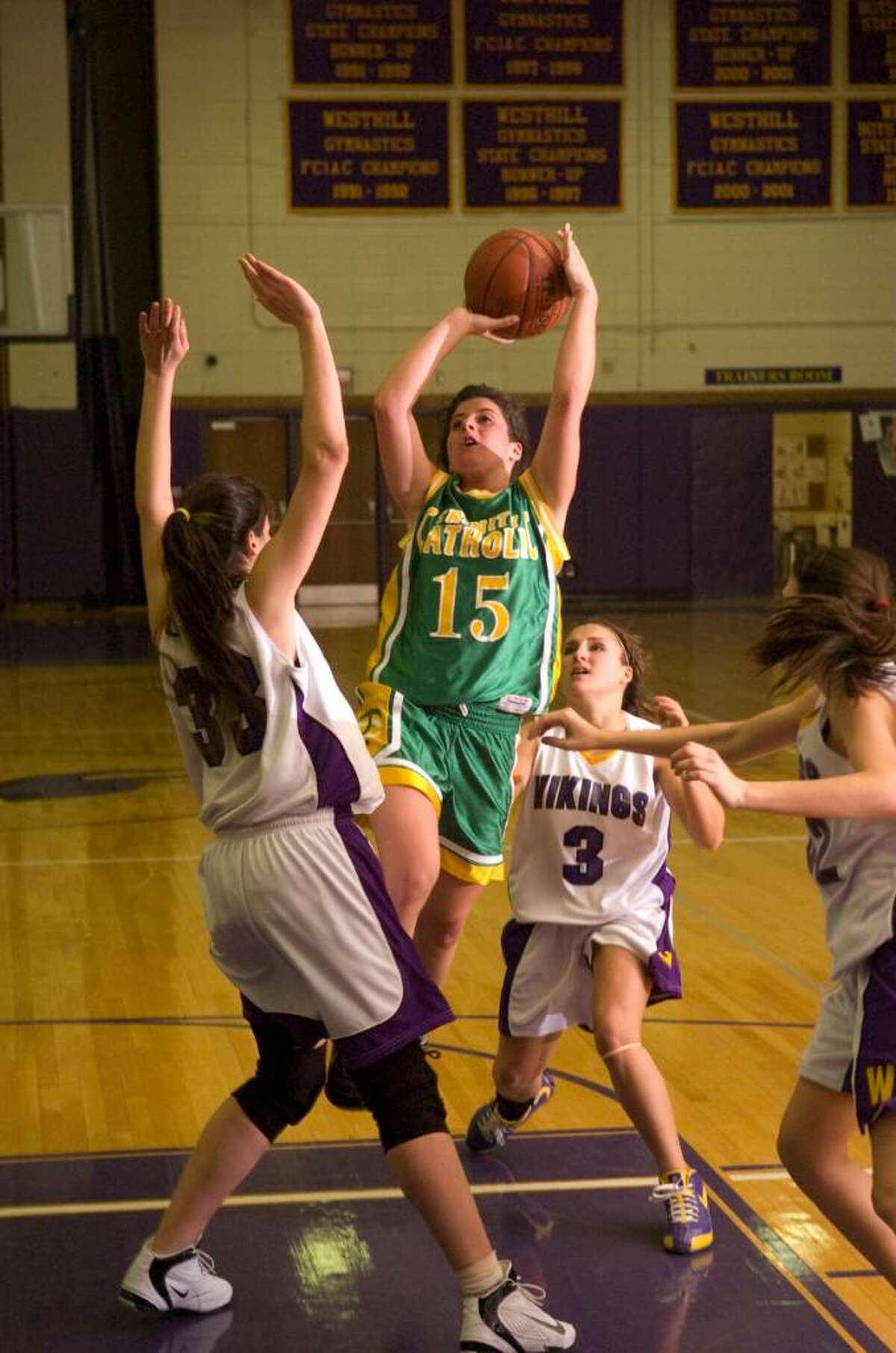 Trinity's Erin Sottosanti center, shoots during and FCIAC girls basketball game at Westhill High School in Stamford, Conn. on Tuesday, Jan. 12, 2010.