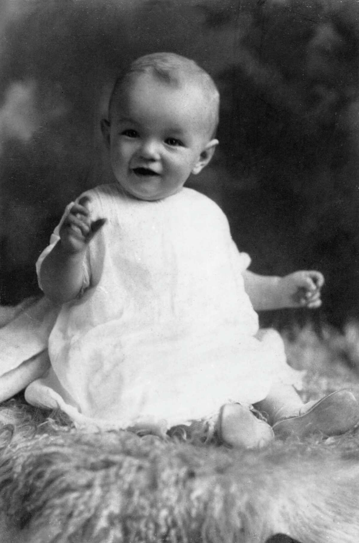 circa 1927: Studio portrait of American actor Marilyn Monroe (born Norma Jean Mortenson, 1926 - 1962) at the age of six months, sitting on a woolly rug in a white smock. (Photo by Hulton Archive/Getty Images)