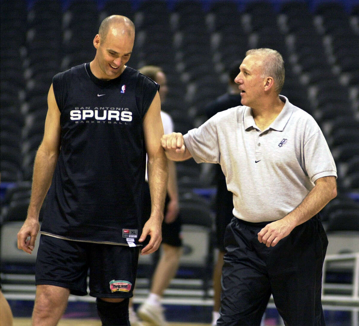 Spurs coach Gregg Popovich works with Danny Ferry during practice during the playoffs on May 16, 2001 at the Alamodome in San Antonio.