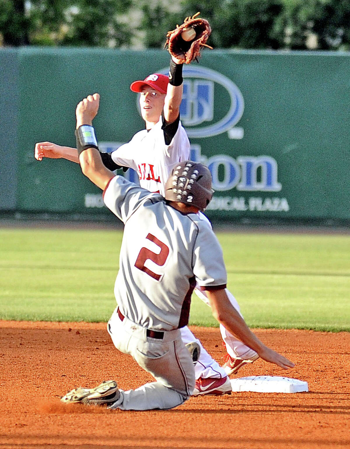 Silsbee pinch runner Kris Elers, #, is thrown out at second during the Silsbee High School district baseball game against Diboll High School at the University of Houston on Thursday, May 30, 2013. Photo taken: Randy Edwards/The Enterprise