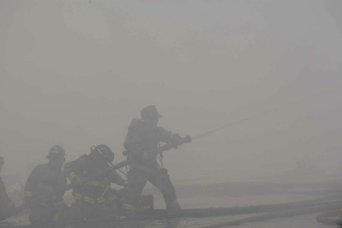 Fire fighters battle the fire.