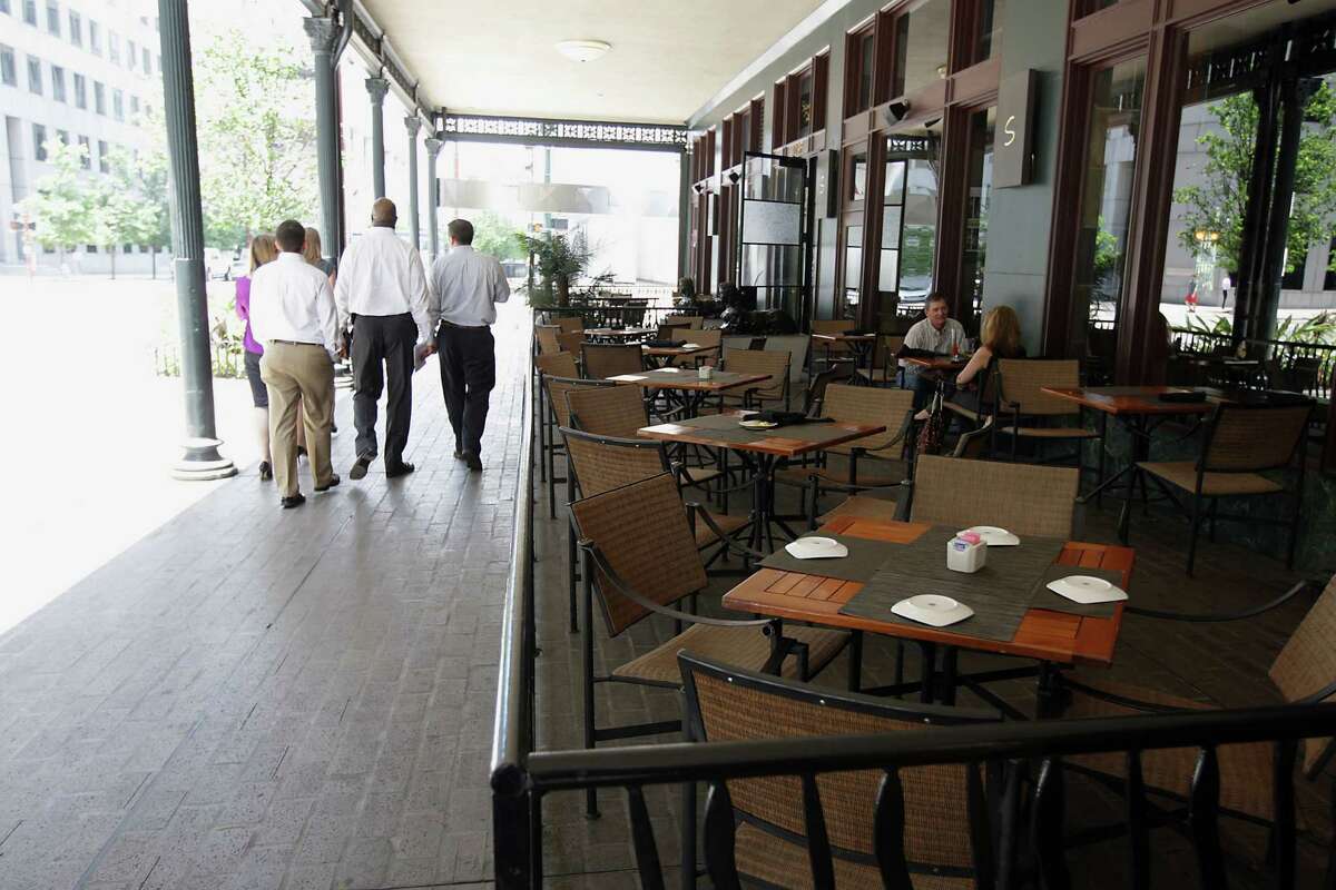 The Post Rice Lofts building provides shade for outside diners at Sambuca restaurant.