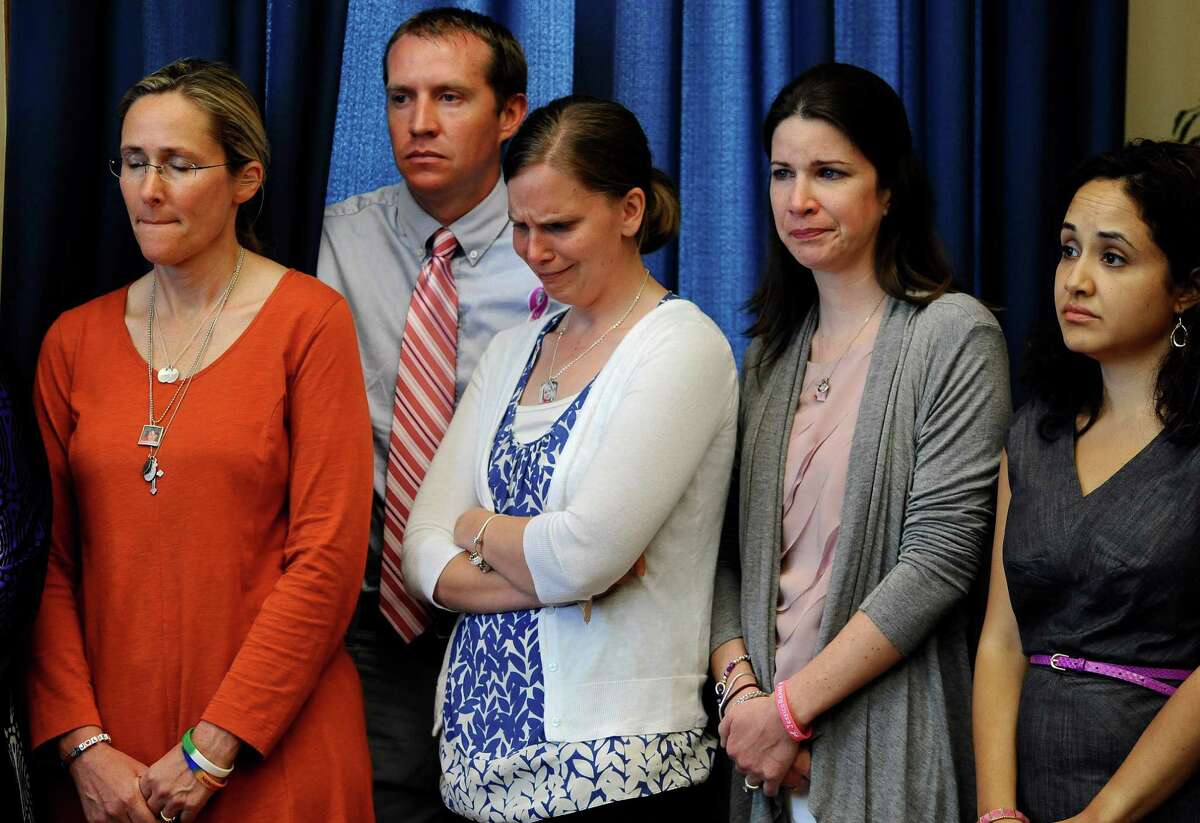 Scarlett Lewis, left, mother of Sandy Hook School shooting victim Jesse Lewis, Robbie and Alissa Parker, parents of victim Emilie Parker, left center, Krista Rekos, right center, mother of victim Jessica Rekos, and Nelba Marquez-Greene, mother of victim Ana Marquez-Greene, right, listen during a news conference at the Capitol in Hartford, Conn., Friday, May 31, 2013. Family members of the school shooting victims are making a last-minute appearance at the state Capitol to urge Connecticut legislators to pass a bill that would block the public release of crime scene photos and other records from the massacre.