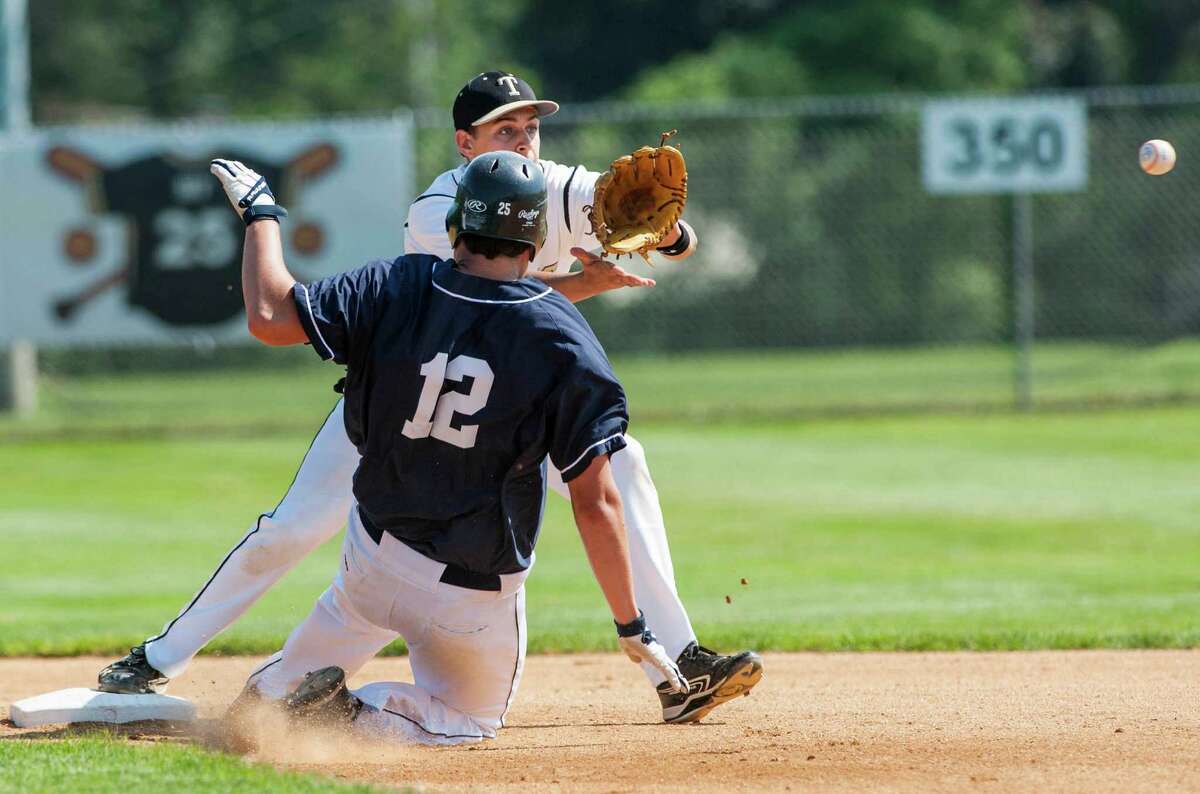 Staples high school's Bryan Porter slides into second base as Trumbull high school shortstop, Luke Waldek, gets a throw to try to complete a double play in a CIAC class LL quarterfinal baseball game played at Trumbull high school, Trumbull, CT on Saturday, June 1st, 2013.