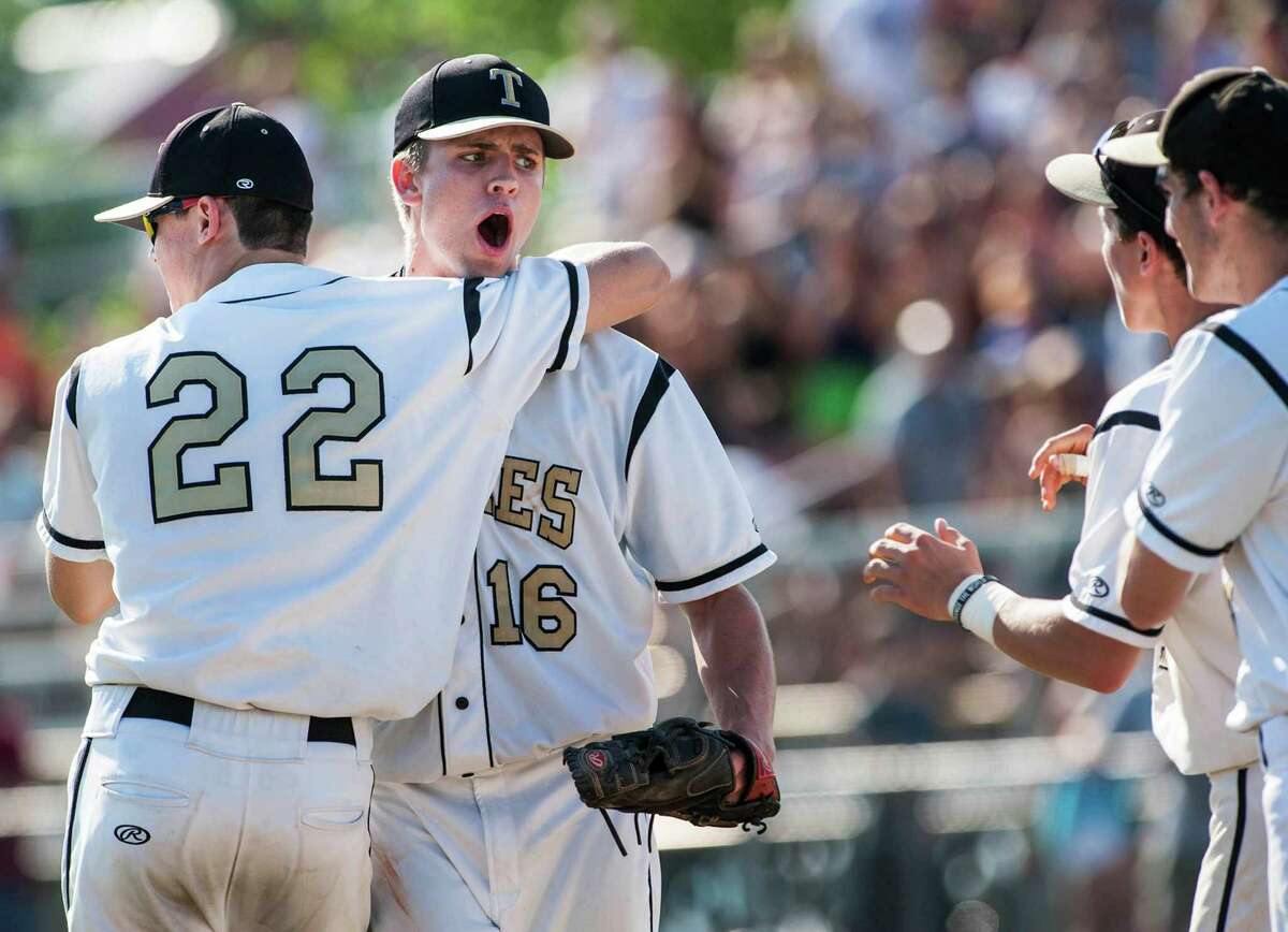 Trumbull high school's Liam Moore comes out to the mound to congratulate pitcher, Gerard Spiegel, after defeating Staples high school in a CIAC class LL quarterfinal baseball game played at Trumbull high school, Trumbull, CT on Saturday, June 1st, 2013.