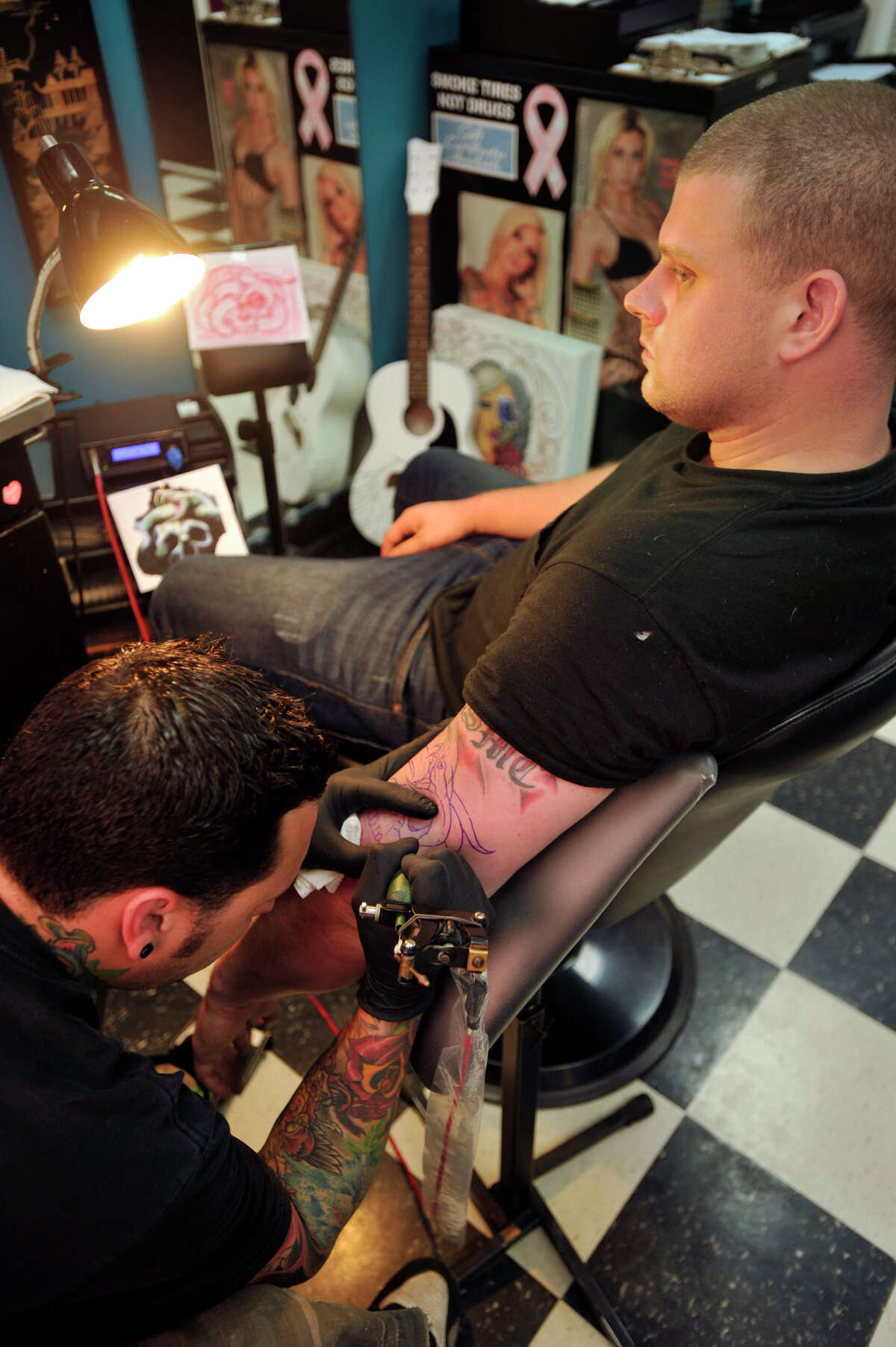 State considers licensing tattoo artists