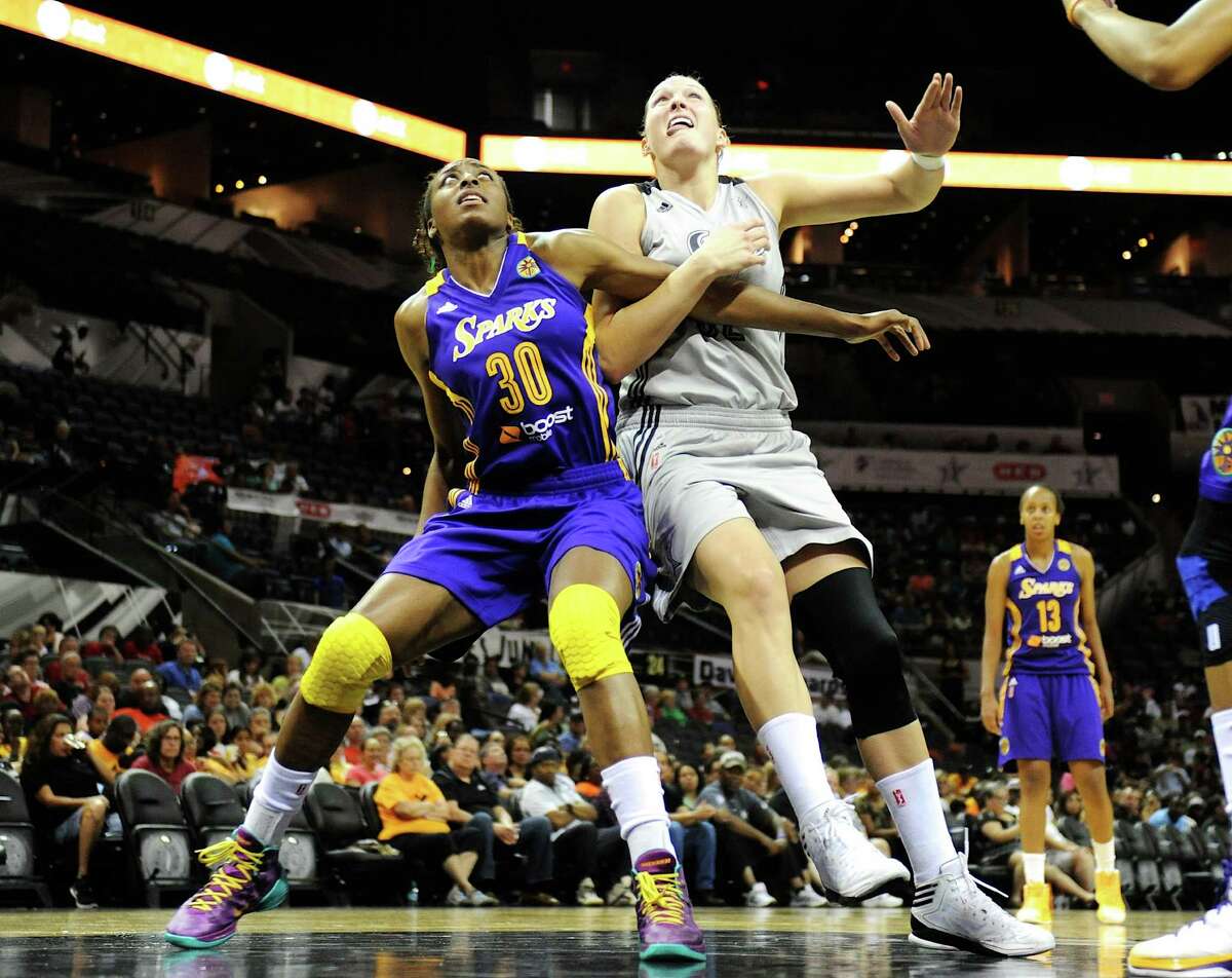 Los Angeles Sparks' Nneka Ogwumike (30) and San Antonio Silver Stars' Jayne Apple (right) battle for position to make a rebound during a WNBA game at the AT&T Center. John Albright / Special to the Express-News