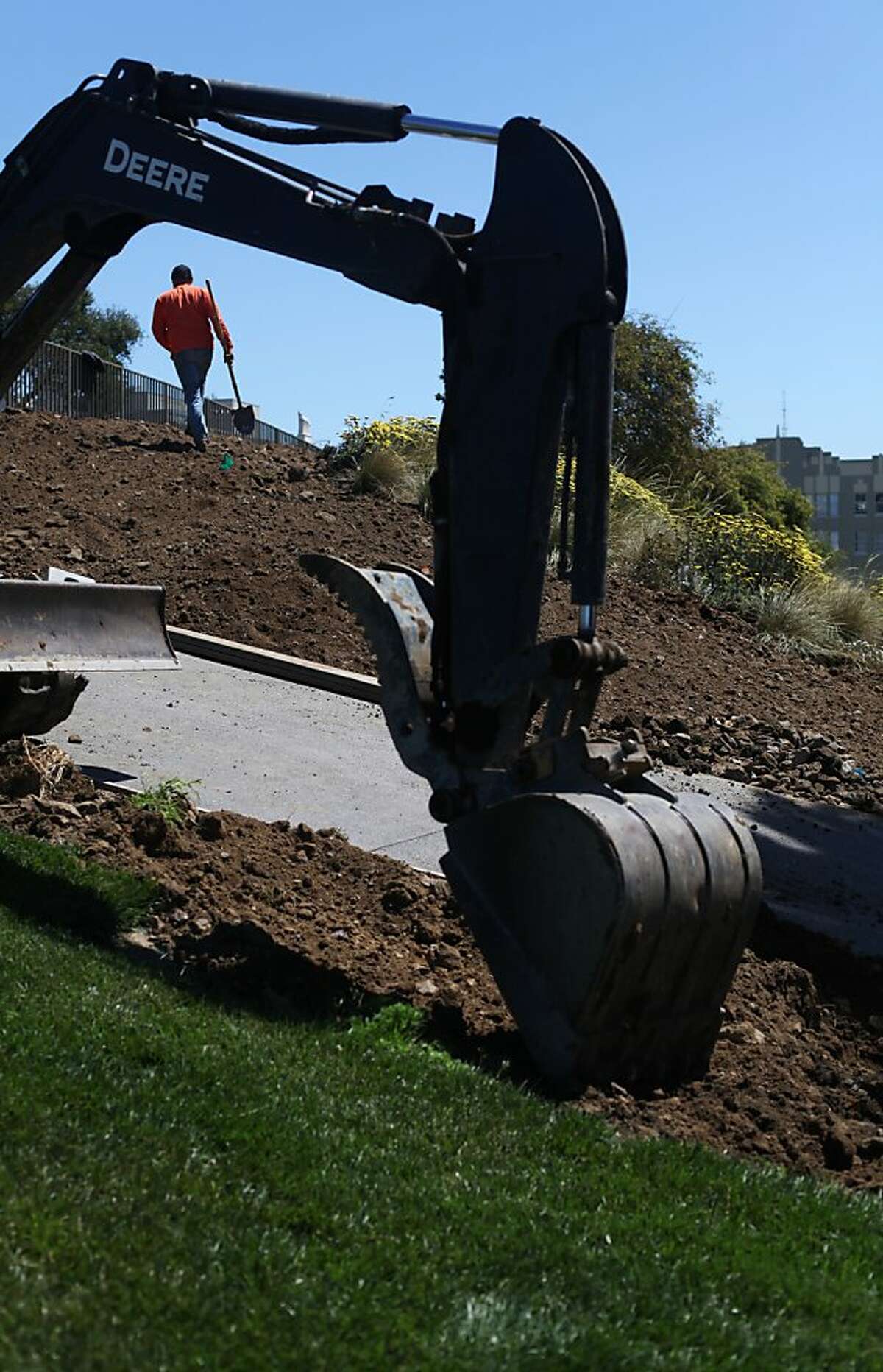 Francisco Magana walks up a hill on the south side of Lafayette Park on May 30, 2013 in San Francisco, Calif. Magana was grading soil in preparation for planting more flowers. Lafayette Park is slated to reopen June 8, 2013.