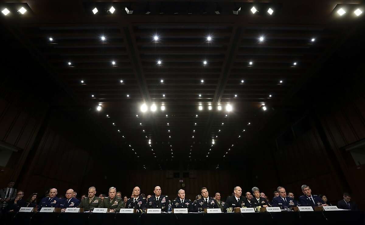 WASHINGTON, DC - JUNE 04: U.S. military leaders, including all six members of the Joint Chiefs of Staff, testify before the Senate Armed Services Committee on pending legislation regarding sexual assaults in the military June 4, 2013 in Washington, DC. A recent survey of active duty personnel by the Pentagon revealed that 6.1 percent of women and 1.2 percent of men reported receiving "unwanted sexual contact" in the past year. Pictured (L-R) Judge Advocate General of the Coast Guard Rear Adm. Frederick Kenney Jr.; Commandant of the Coast Guard Adm. Robert Papp Jr.; Staff Judge Advocate to the Commandant of the Marine Corps Maj. Gen. Vaughn Ary; Commandant of the Marine Corps Gen. James Amos; Judge Advocate General of the Army Lt. Gen. Dana Chipman; Chief of Staff of the Army Gen. Raymond Odierno; Chairman of the Joint Chiefs of Staff Gen. Martin Dempsey; Legal Counsel to the Chairman of the Joint Chiefs of Staff Brig. Gen. Richard Gross; Chief of Naval Operations Adm. Jonathan Greenert; Judge Advocate General of the Navy Vice Adm. Nanette DeRenzi; Chief of Staff of the Air Force Gen. Mark Welsh III; and Judge Advocate General of the Air Force Lt. Gen. Richard Harding. (Photo by Win McNamee/Getty Images) *** BESTPIX ***