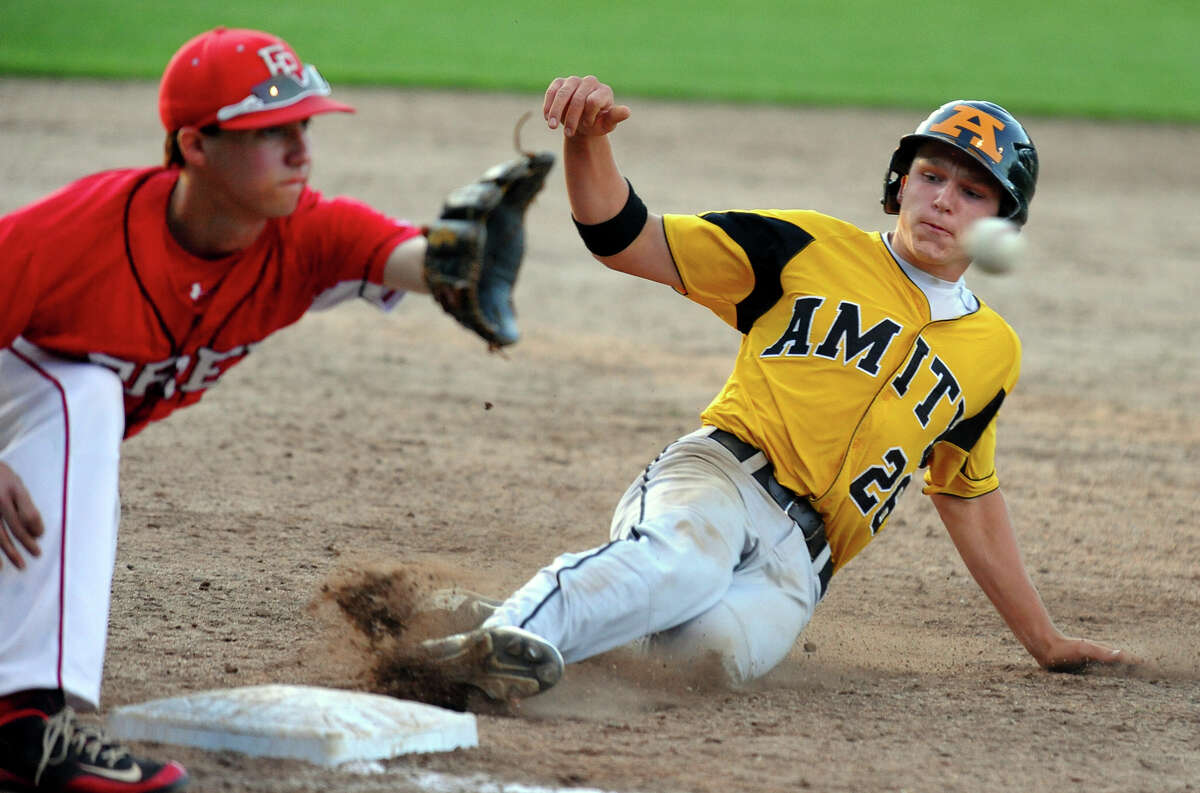 Amity's Sebastian DiMauro slides into third base in a steal attempt as Fairfield Prep's David Gerics receives the ball, during Class LL Semifinal baseball action in Bristol, Conn. on Tuesday June 5, 2013. DiMauro was called safe.
