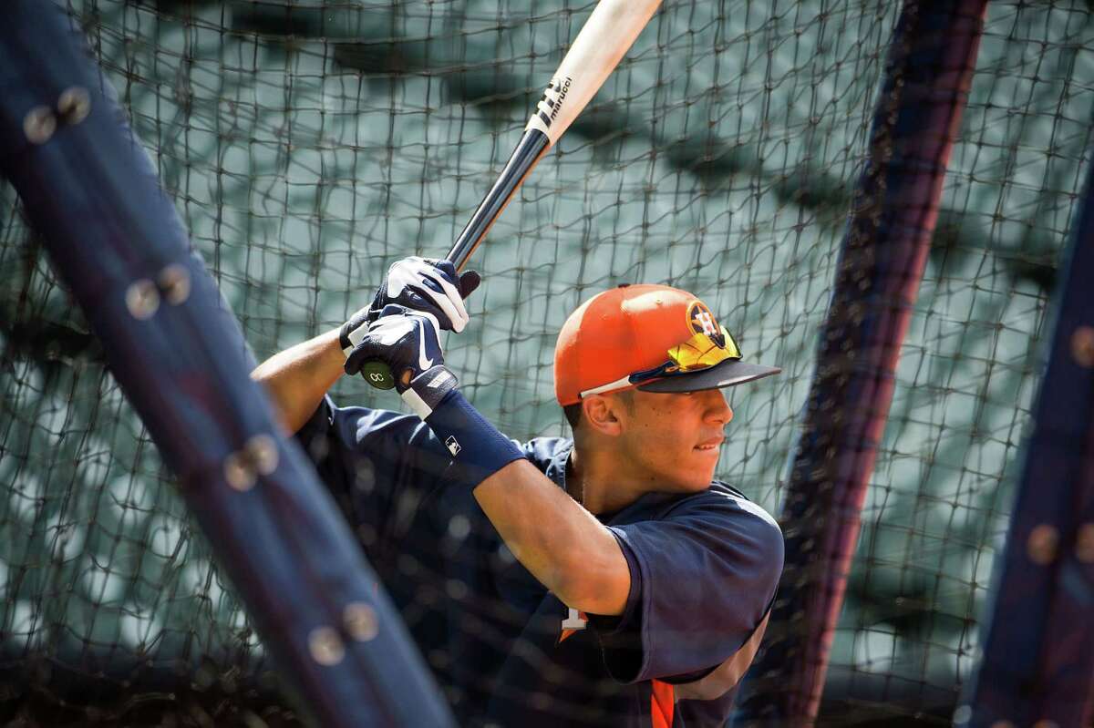 Shortstop prospect Carlos Correa takes batting practice before an exhibition game against the Chicago Cubs at Minute Maid Park on March 29. The next day against the Cubs, Correa went 3-for-4 with an RBI.