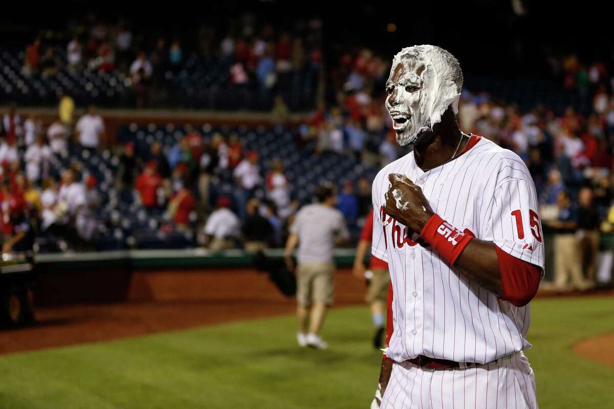 John Mayberry Jr. paid a price - an ice-water bath and a shaving-cream pie in the face - for his 11th-inning grand slam that gave the Phillies a 7-3 win over Miami.
