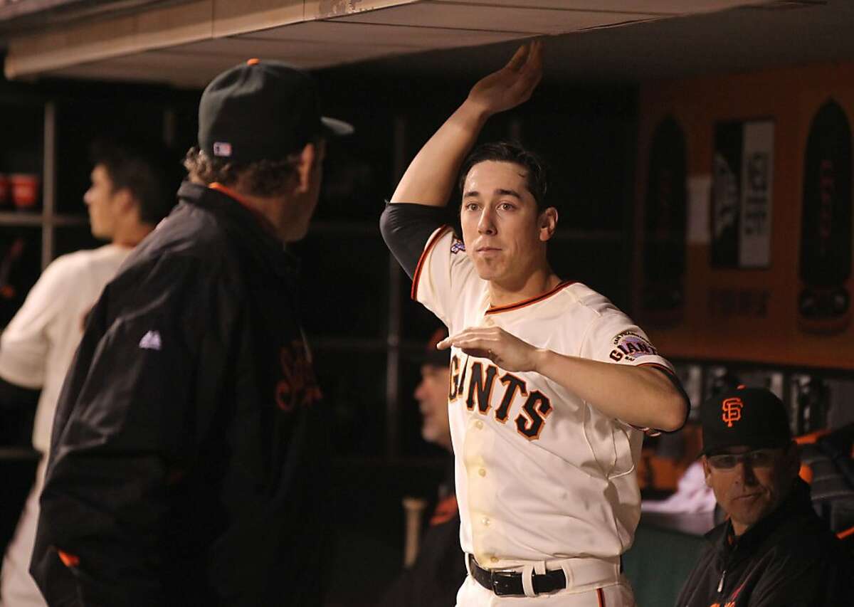 Tim Lincecum starting pitcher of the San Francisco Giants right talk with the Giants pitching coach Dave Righetti at the end of the 6th inning of their MLB baseball game with the Toronto Blue Jays Tuesday, June 4, 2013 in San Francisco Calif.