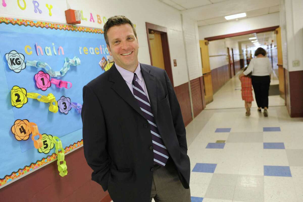 Poestenkill Elementary School principal Peter DeWitt stands in a hallway on Wednesday, June 5, 2013 in Poestenkill, N.Y. DeWitt talked to us about field tests given to New York's students on behalf of the Pearson testing company. (Lori Van Buren / Times Union)