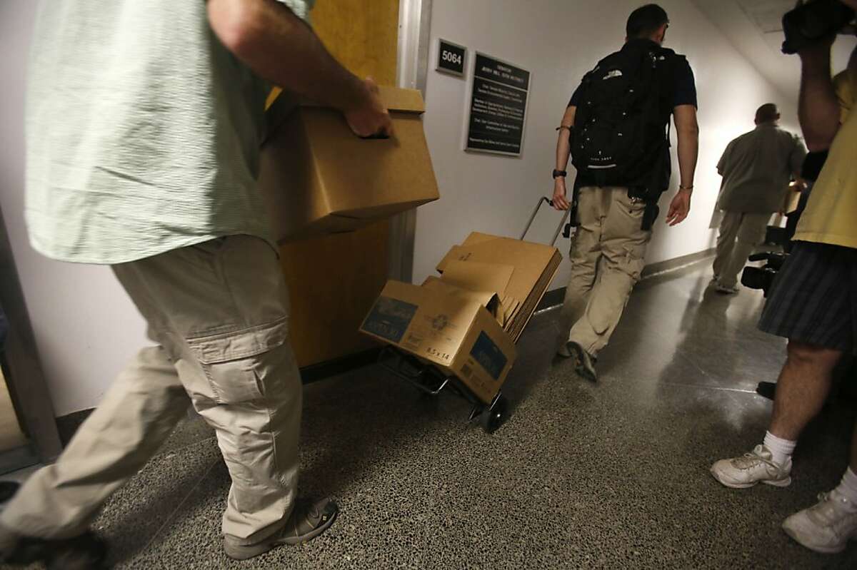 FBI agents leave with boxes of material from the Capitol office of State Sen. Ron Calderon, D-Montebello, in Sacramento, Calif., Tuesday, June 4, 2013. Search warrants were served about at Calderon's office and the office of the Legislature's Latino caucus, around 3 p.m., but would not disclose the reason for the investigation. Calderon was not present during the search.(AP Photo/Rich Pedroncelli)