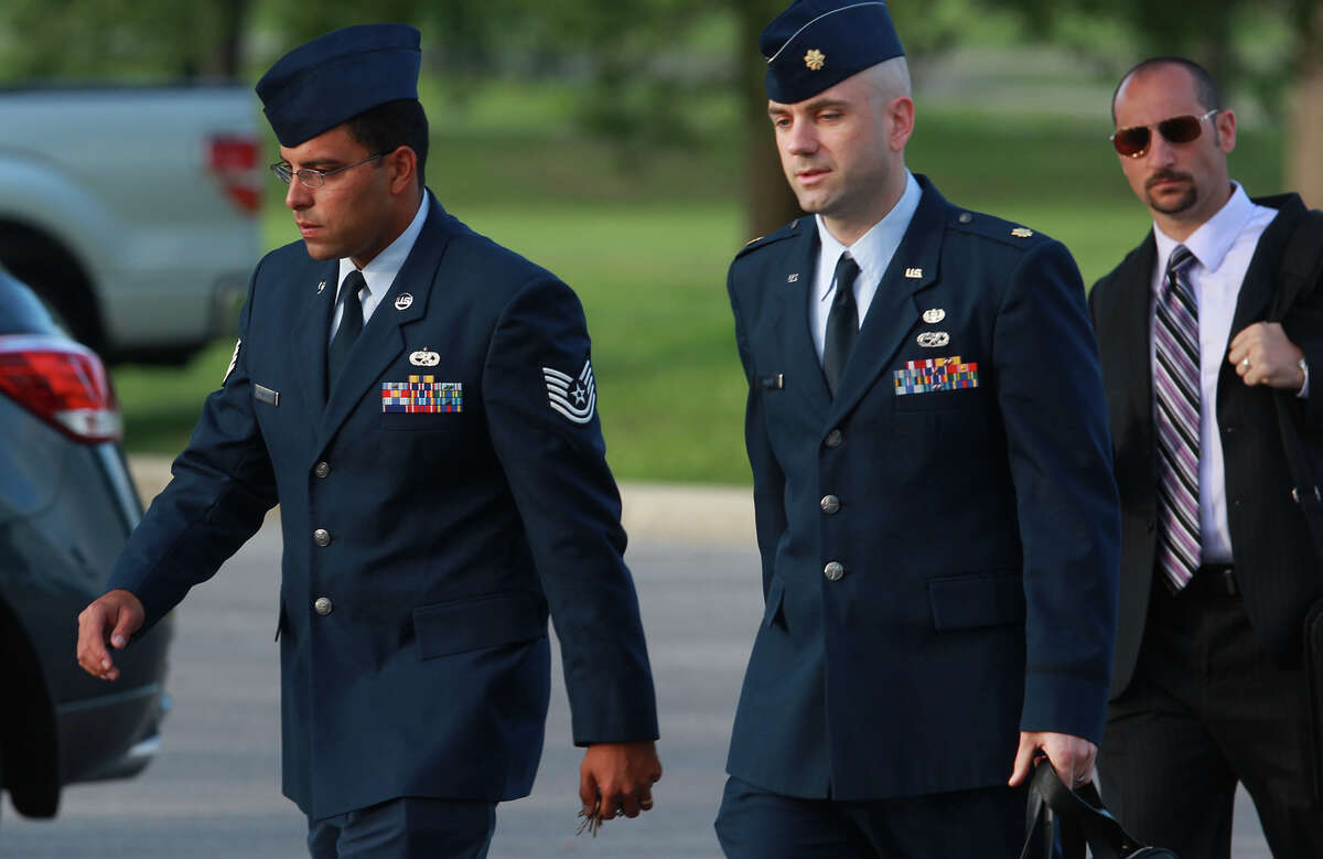 Air Force Tech Sergeant Jaime Rodriguez (left) heads for court Thursday June 6, 2013 at Joint Base San Antonio-Lackland. He is accused of having illicit contact with 18 women, and having sex with four of them.